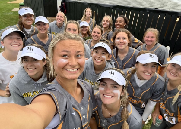 smiling softball team selfie