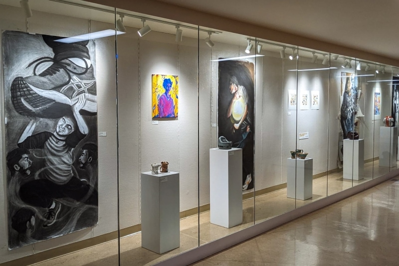 gallery with artwork behind glass