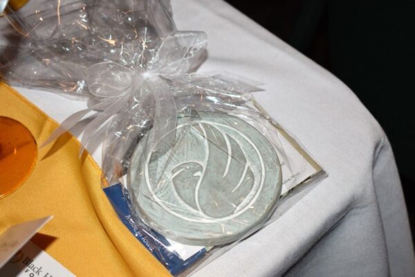 ornament with Black Hawk College logo on a table