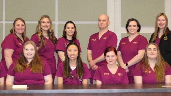 14 vet tech students in scrubs