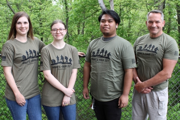 4 people wearing What's Your 22 T-shirts