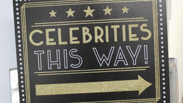 glittery sign that says Celebrities this way!